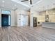 A spacious and open floor plan in a home featuring a kitchen, living room, and an impressive entryway at 7152 Bougainvillea St, Englewood, FL 34224
