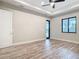 Spacious main bedroom with tray ceiling, ceiling fan, and luxury vinyl plank flooring at 7152 Bougainvillea St, Englewood, FL 34224