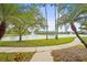 View of the pond featuring lush landscaping and water fountain at 8821 Manor Loop # 205, Lakewood Ranch, FL 34202