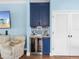 Stylish bar area with custom cabinetry, wine fridge, and elegant decor at 8911 Heritage Sound Dr, Bradenton, FL 34212