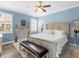 Serene bedroom with a decorative fireplace and shuttered windows, offering a peaceful retreat at 8911 Heritage Sound Dr, Bradenton, FL 34212