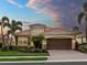 Charming single-story home with a tile roof, manicured landscaping, and a two-car garage at 8911 Heritage Sound Dr, Bradenton, FL 34212