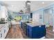 Well-equipped kitchen with a central island and stainless steel appliances, blending seamlessly with the living area at 8911 Heritage Sound Dr, Bradenton, FL 34212