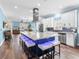 Spacious kitchen featuring a large island with seating, modern appliances, and plenty of cabinet space at 8911 Heritage Sound Dr, Bradenton, FL 34212