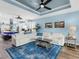 Bright living room with ample seating and an open layout connecting to the kitchen at 8911 Heritage Sound Dr, Bradenton, FL 34212