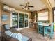 Outdoor kitchen with built-in grill, bar, and seating area with view of the pool at 8911 Heritage Sound Dr, Bradenton, FL 34212
