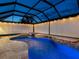 Gorgeous pool with beautiful waterfall, colorful lights and screened enclosure at 8911 Heritage Sound Dr, Bradenton, FL 34212
