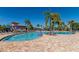 Inviting community pool area with ample seating and shade, ideal for relaxation and socializing at 8911 Heritage Sound Dr, Bradenton, FL 34212
