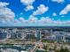 This aerial showcases the vibrant city with its modern high-rises, marina, and lush greenery at 101 S Gulfstream Ave # 16C, Sarasota, FL 34236
