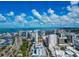 Breathtaking aerial shot of Sarasota highlighting high-rise apartments, roads with trees, and beautiful waterfront scenery on a clear day at 101 S Gulfstream Ave # 16C, Sarasota, FL 34236