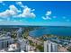 Captivating aerial perspective of Sarasota with luxury apartments overlooking the tranquil bay, surrounded by lush greenery and cityscapes at 101 S Gulfstream Ave # 16C, Sarasota, FL 34236
