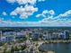 An expansive aerial view reveals the city's skyline, waterfront, and surrounding natural beauty at 101 S Gulfstream Ave # 16C, Sarasota, FL 34236