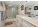 Modern bathroom featuring updated vanity, bathtub with glass enclosure, and contemporary fixtures at 101 S Gulfstream Ave # 16C, Sarasota, FL 34236