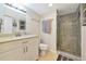 Bright bathroom features a tiled walk-in shower and modern vanity at 101 S Gulfstream Ave # 16C, Sarasota, FL 34236