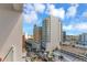 Stunning city view of downtown with modern buildings, palm trees, and beautiful blue skies at 101 S Gulfstream Ave # 16C, Sarasota, FL 34236