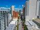 Impressive aerial view of a bustling city street surrounded by high-rise buildings and palm trees at 101 S Gulfstream Ave # 16C, Sarasota, FL 34236