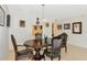 Elegant dining room with chandelier and seating for four people at 101 S Gulfstream Ave # 16C, Sarasota, FL 34236