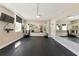 Spacious workout room featuring mirrors, weight balls, and workout equipment at 101 S Gulfstream Ave # 16C, Sarasota, FL 34236