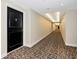 Hallway of the building's interior, featuring patterned carpeting at 101 S Gulfstream Ave # 16C, Sarasota, FL 34236
