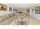 Living room with tile flooring and comfortable seating adjacent to dining area at 101 S Gulfstream Ave # 16C, Sarasota, FL 34236