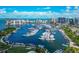 Breathtaking aerial shot capturing a picturesque marina filled with numerous boats against a cityscape backdrop at 101 S Gulfstream Ave # 16C, Sarasota, FL 34236