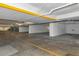 Well-lit parking garage area with designated parking spots at 101 S Gulfstream Ave # 16C, Sarasota, FL 34236