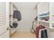 Walk-in closet features built-in shelving to store clothes and accessories, and is kept well lit at 101 S Gulfstream Ave # 16C, Sarasota, FL 34236
