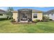 Landscaped backyard with a screened-in patio and well-maintained lawn at 11835 Crawford Parrish Ln, Parrish, FL 34219