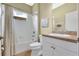 Bathroom featuring a shower-tub combo with white tile, a toilet, and single vanity at 11835 Crawford Parrish Ln, Parrish, FL 34219