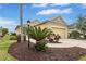 Inviting single-Gathering home featuring beautiful landscaping and an attached two-car garage at 11835 Crawford Parrish Ln, Parrish, FL 34219