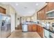 Spacious kitchen with stainless steel appliances and open layout to the living room at 11835 Crawford Parrish Ln, Parrish, FL 34219