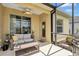 Covered lanai offering a comfortable seating area and scenic views of the outdoor landscape at 11835 Crawford Parrish Ln, Parrish, FL 34219