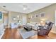 Comfortable living room with hardwood floors and neutral walls at 11835 Crawford Parrish Ln, Parrish, FL 34219