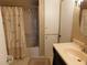 Well-lit bathroom featuring a bathtub, shower, vanity, and linen closet at 1212 45Th E Ave, Ellenton, FL 34222