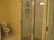 Bathroom featuring a glass shower, toilet, and towel rack with tile flooring at 12301 Mosswood Pl, Lakewood Ranch, FL 34202
