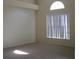 Spacious bedroom with neutral carpet, large window, and vaulted ceiling at 12301 Mosswood Pl, Lakewood Ranch, FL 34202