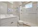 Bright bathroom featuring a glass shower, a white vanity, and coastal decor at 13918 Old Creek Ct, Parrish, FL 34219