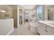 Bathroom featuring a soaking tub, double vanity, glass enclosed shower, and neutral tones at 13918 Old Creek Ct, Parrish, FL 34219