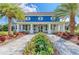 Charming two-story clubhouse with inviting entrance and lush landscaping at 13918 Old Creek Ct, Parrish, FL 34219