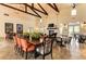 Spacious dining area with wood beams, large tables, and stylish seating at 13918 Old Creek Ct, Parrish, FL 34219