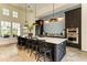 Spacious kitchen with large island, modern appliances, and stylish tile backsplash at 13918 Old Creek Ct, Parrish, FL 34219