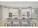 Bright kitchen features a center island, stainless appliances, and eat in bar seating at 13918 Old Creek Ct, Parrish, FL 34219