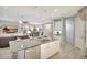 Gourmet eat-in kitchen includes an oversized island with a sink and stainless steel dishwasher at 13918 Old Creek Ct, Parrish, FL 34219