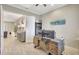 Bright home office features a large desk, ceiling fan, and is open to the entry at 13918 Old Creek Ct, Parrish, FL 34219
