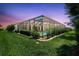Inviting screened pool area with lush landscaping and a vibrant sunset at 13918 Old Creek Ct, Parrish, FL 34219