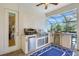 Well-equipped outdoor summer kitchen with stainless steel appliances and a bar area for entertaining at 13918 Old Creek Ct, Parrish, FL 34219