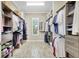 Spacious walk-in closet with custom shelving and organization systems for optimal storage at 13918 Old Creek Ct, Parrish, FL 34219