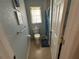 Compact bathroom featuring a toilet, window, tile flooring and neutral wall color at 1500 Crest Dr, Englewood, FL 34223