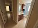 Bathroom with wooden vanity and drawers, tiled walls, and a shower-tub combo at 1500 Crest Dr, Englewood, FL 34223