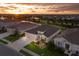 A beautiful, expansive single-Gathering home with manicured lawn and stunning sunset view at 16807 Barnwood Pl, Bradenton, FL 34211